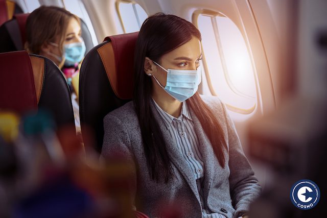 woman with mask on airplane
