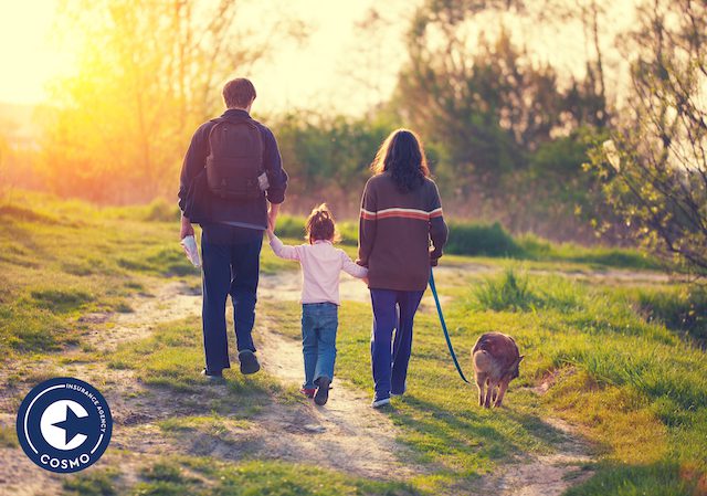family walking dog