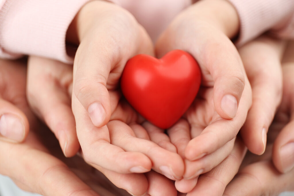 arents,And,Kid,Holding,Red,Heart,In,Hands,,Closeup.,Family