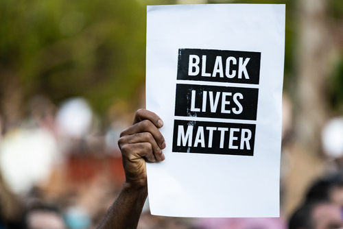 Oakland,,California,,Usa,-,6/10/2020:,Protestor,Raises,Black,Lives,Matter
